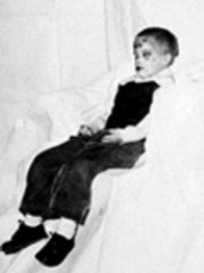 Two photos of the unknown boy dressed in typical children's clothing. An attempt by detectives to make him "more recognizable".