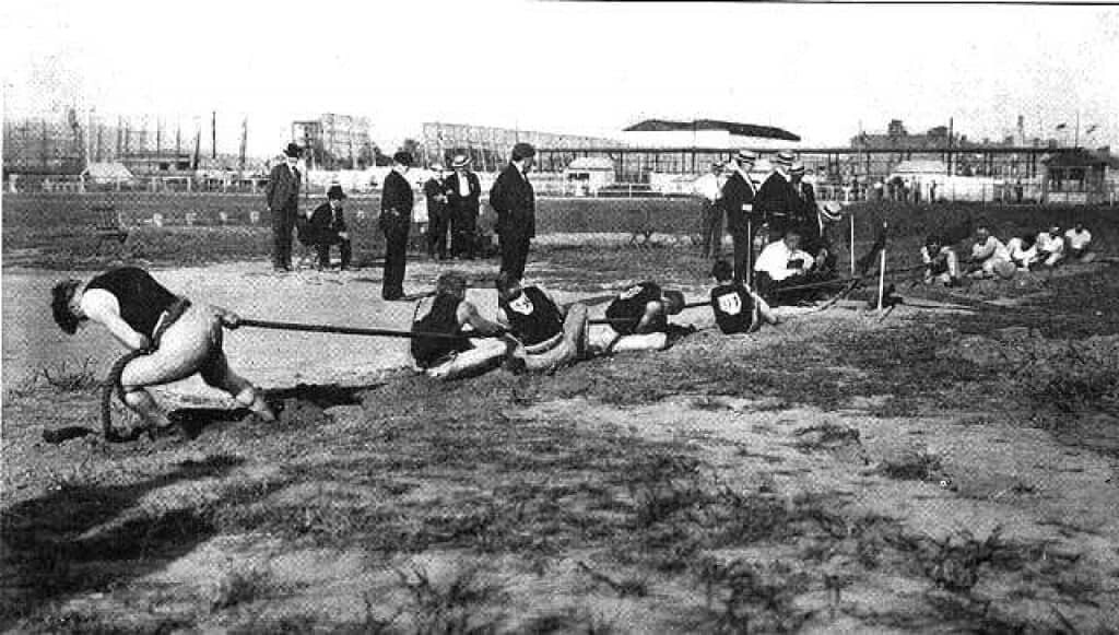 The Tug of War competition from 1904 is a discontinued Olympic sport. Public domain.